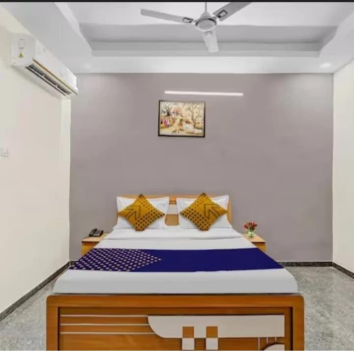 a bedroom with a large bed in a room at Hotel krishna in Mānsa