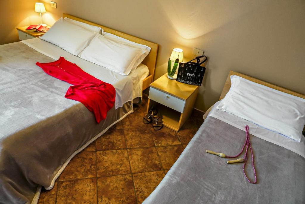 Postel nebo postele na pokoji v ubytování Villetta Dino