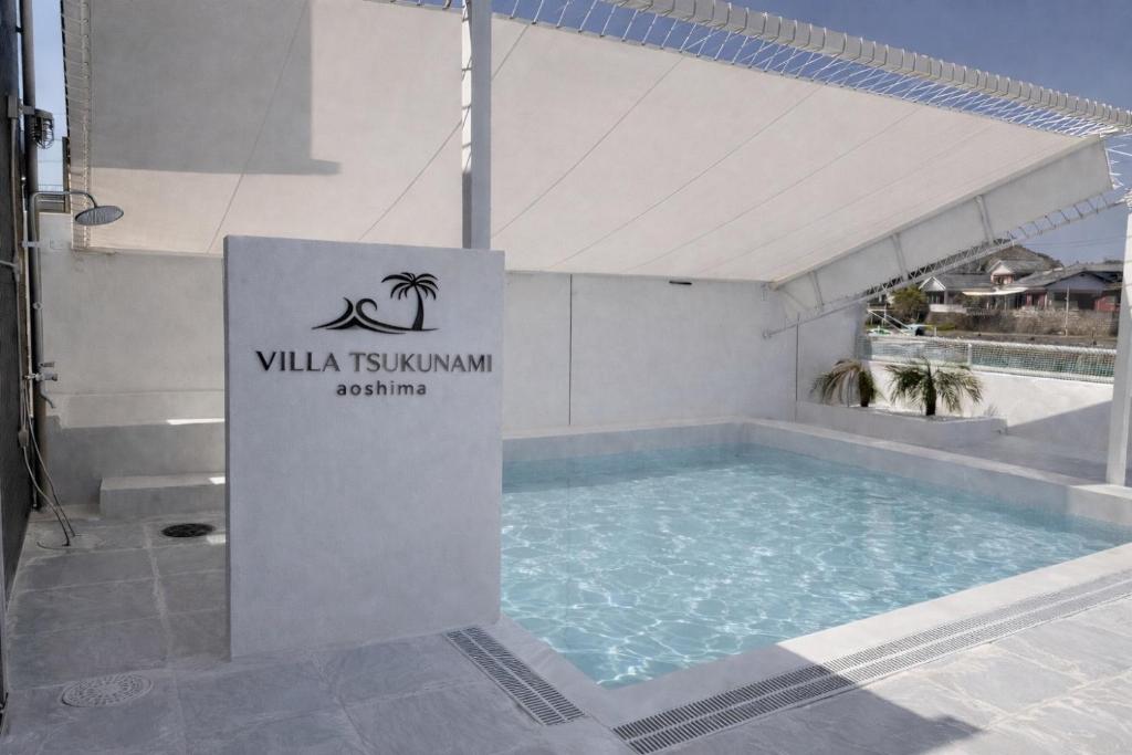 a sign for a swimming pool at a hotel at VILLA TSUKUNAMI aoshima in Miyazaki