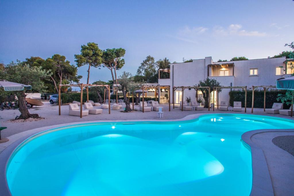 a swimming pool in front of a building at NOHA Lifestyle Hotel - Adults Only in Pula