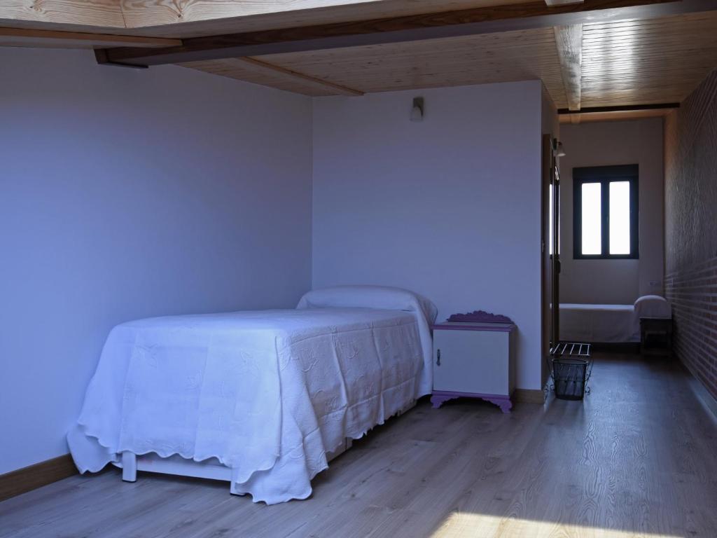 Cama o camas de una habitación en Apartamentos La Rocanda