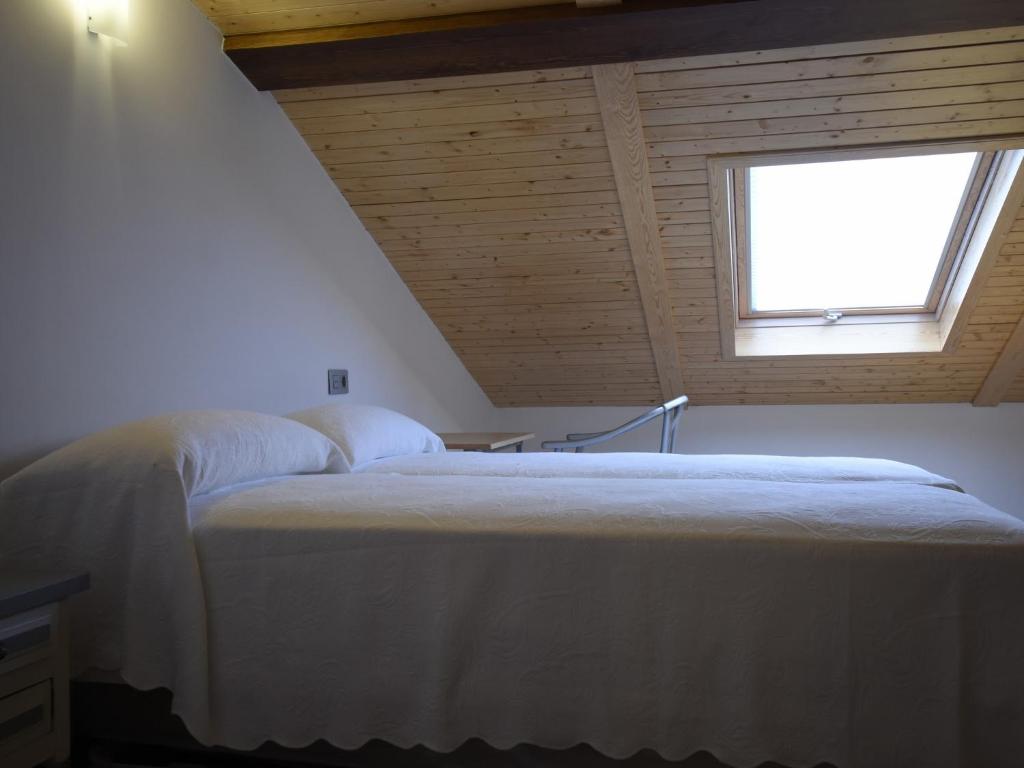 Cama o camas de una habitación en Apartamentos La Rocanda