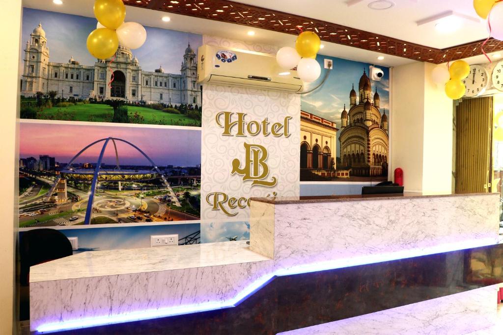a hotel reception counter with a picture of a building at Hotel JBL in kolkata