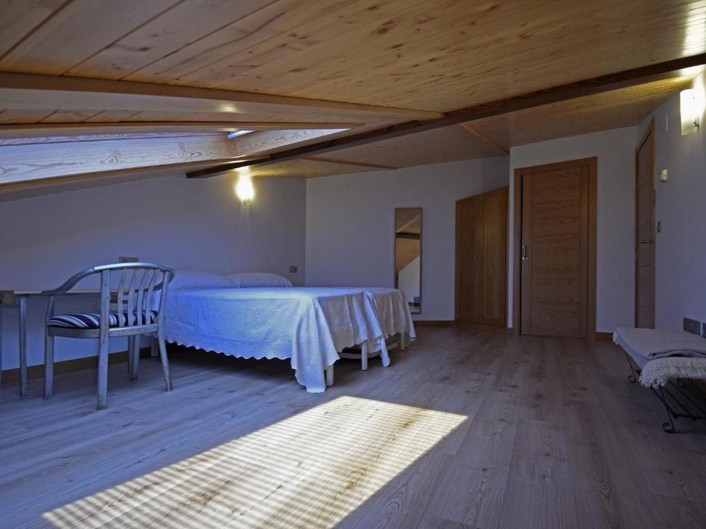 Cama o camas de una habitación en Apartamentos La Rocanda