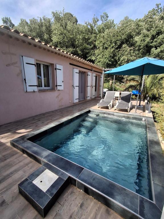 a swimming pool in the backyard of a house at La Motte in La Motte