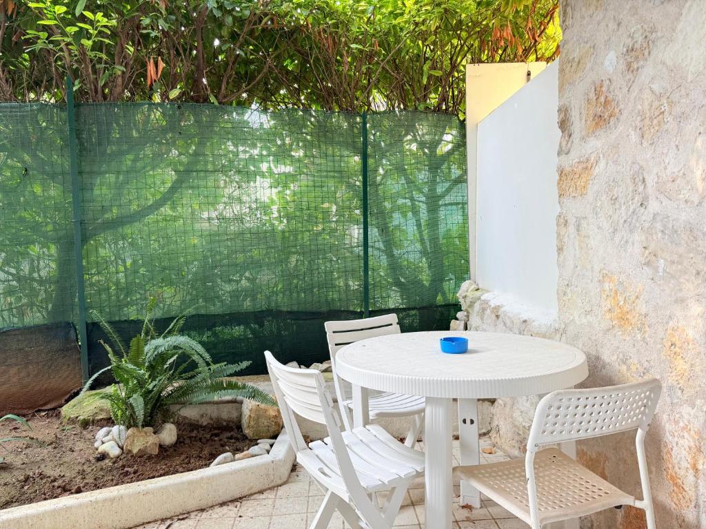 a white table and chairs on a patio at CasaMare - Numana, comodo trilocale in centro in Numana