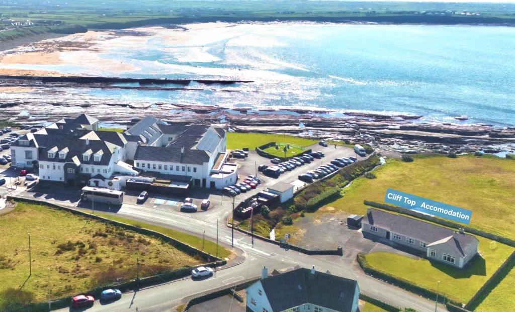 an aerial view of a resort near the ocean at Cliff Top Accommodation in Spanish Point