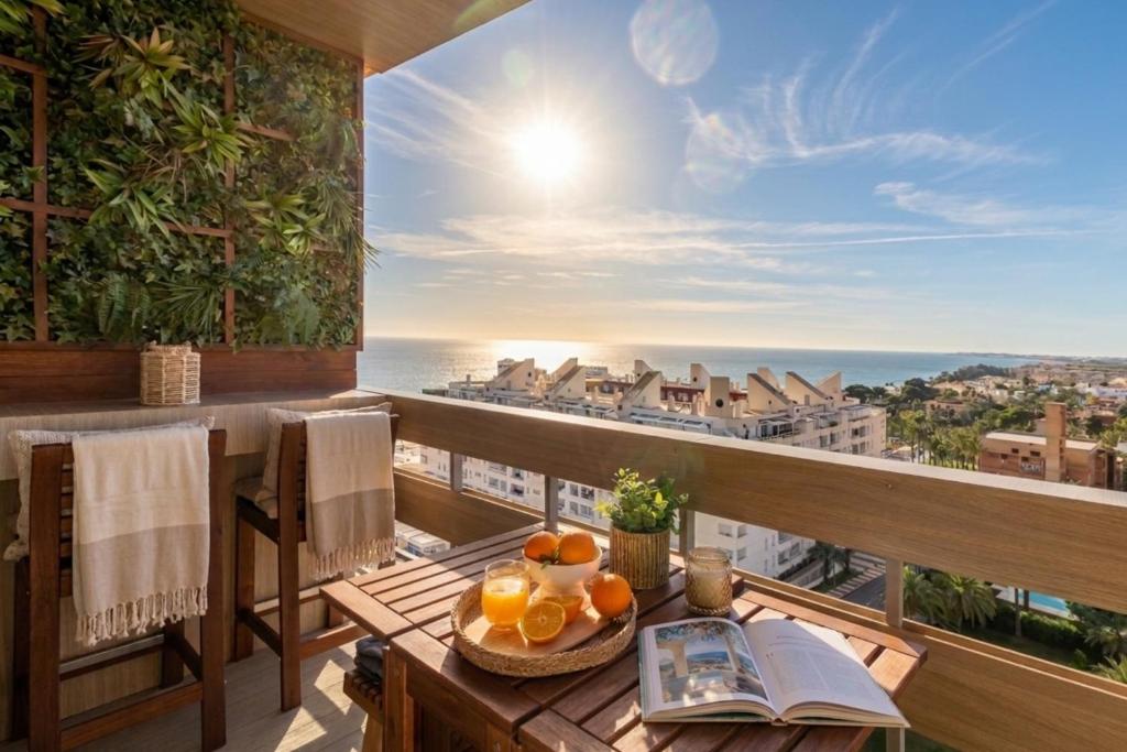 a table with oranges on it on a balcony at Apartamento Dream View Aguadulce in Aguadulce
