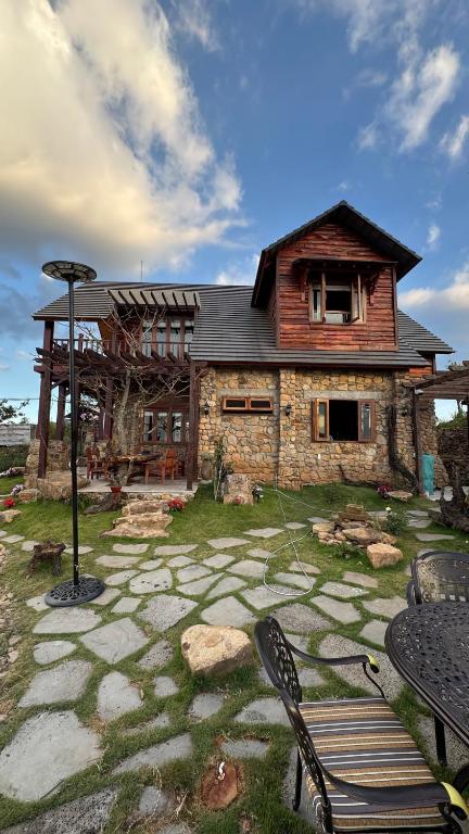 a house with a table and chairs in front of it at R Chai in Countach Da