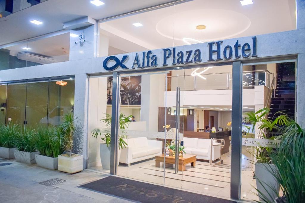 a hotel with a sign that reads akila plaza hotel at Alfa Plaza Hotel in Brasília