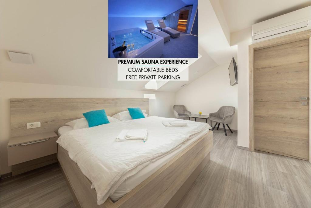 a bedroom with a large bed with blue pillows at Rooms S Center in Slovenske Konjice