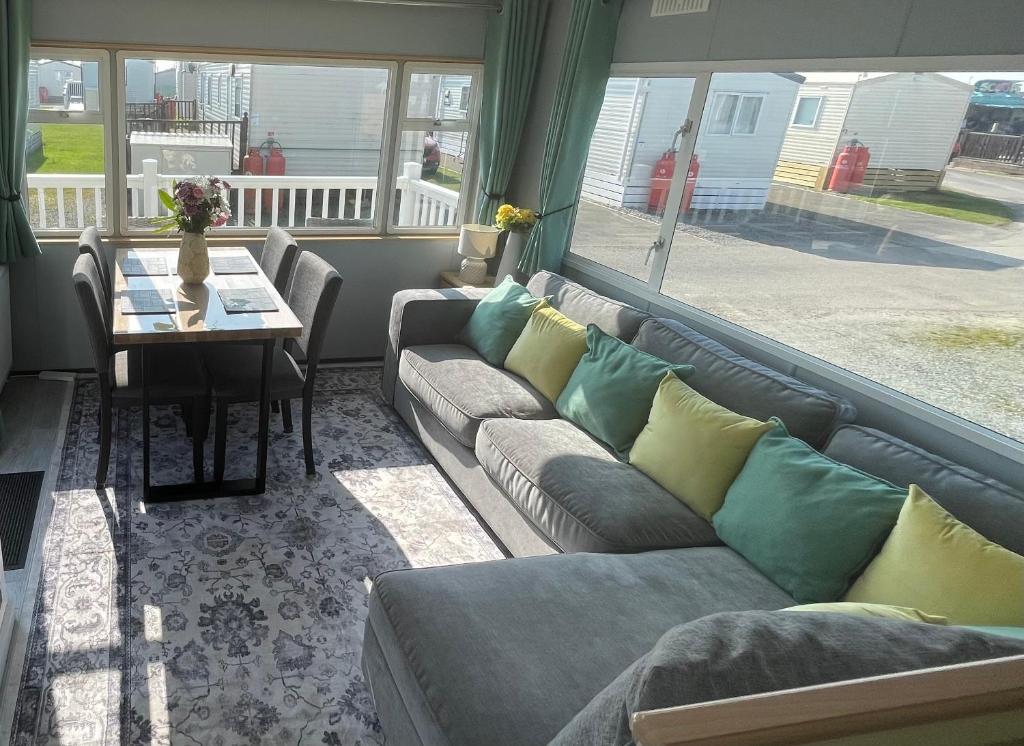 a living room with a couch and a table at The Dean's on the Edge in Heysham