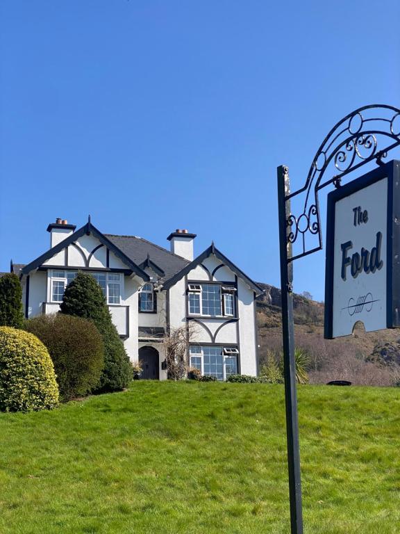 a for sale sign in front of a house at The Ford in Kenmare