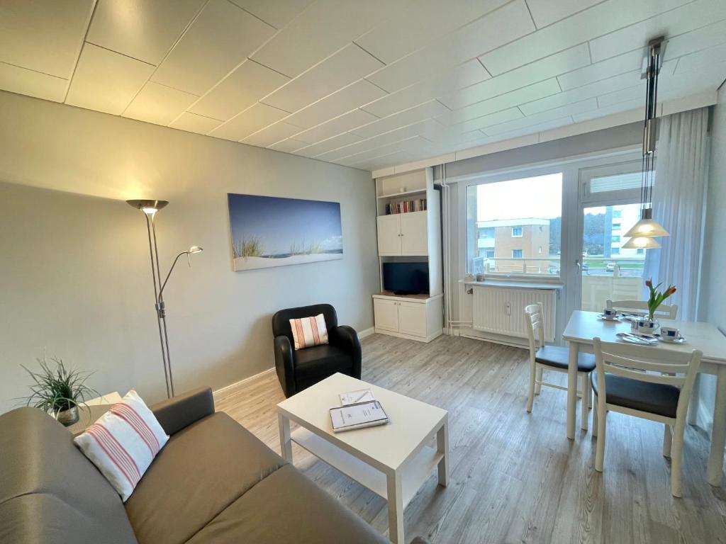 a living room with a couch and a table at App 12-A67 in Westerland