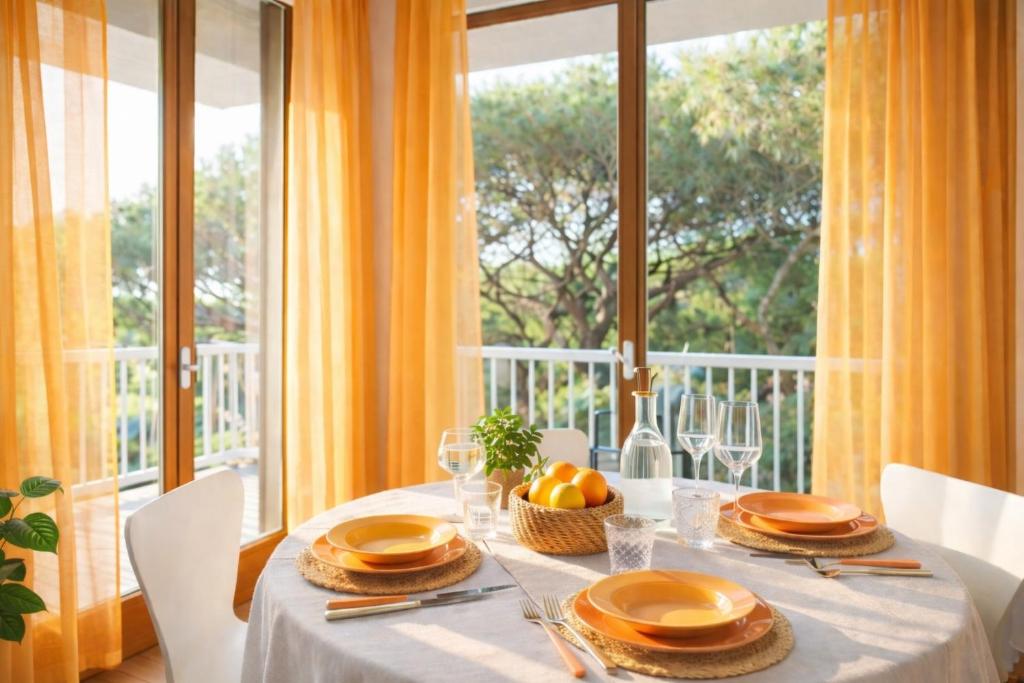 a dining room with a table and a large window at Attico panoramico, a pochi passi dal mare, due parcheggi interni inclusi in Milano Marittima
