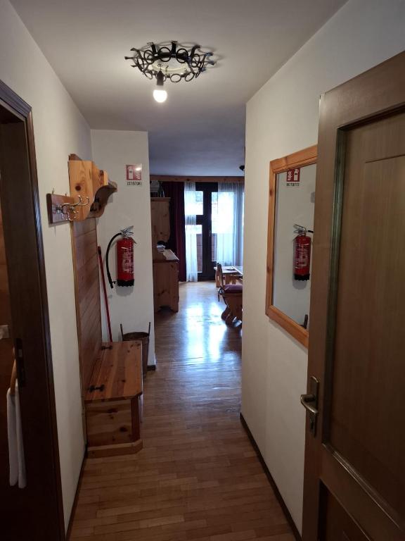 a hallway with a room with a fire hydrant in it at Campiglio Trilocale Cima Tosa in Madonna di Campiglio