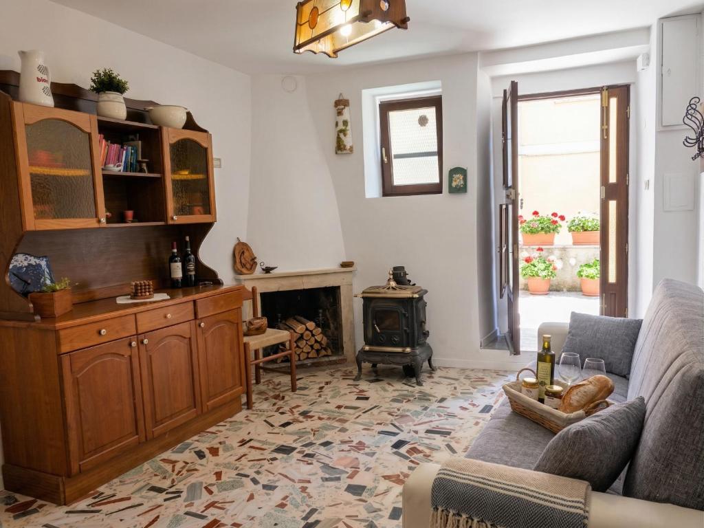 a living room with a couch and a fireplace at La Chiave del Gufo - Bojano in Boiano