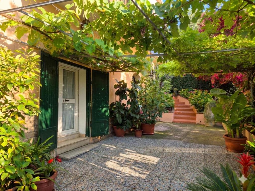 an entrance to a house with potted plants at Mary Casa Vacanza in Monterotondo