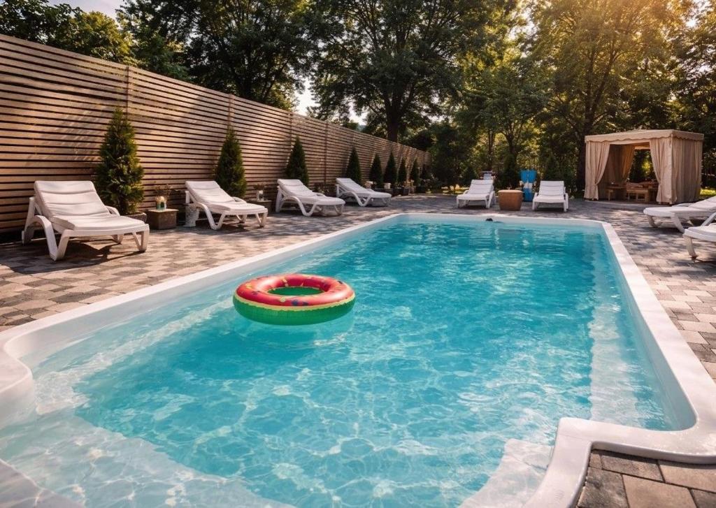 a swimming pool with a frisbee in the water at Panorama H2O Self Check-in Pool in Korosten