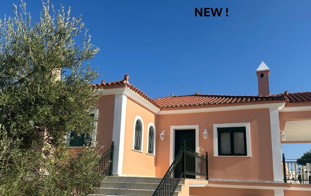 a house with a staircase in front of it at Villa Zante Estrella in Kalamaki
