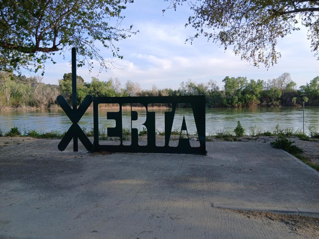 a sign that says xerbia in front of a river at L'Hortet de Can Serra in Xerta
