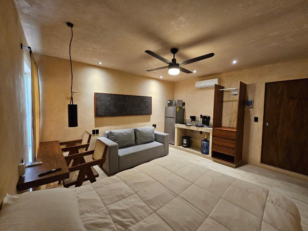a living room with a couch and a table at MID-498 Centro in Mérida