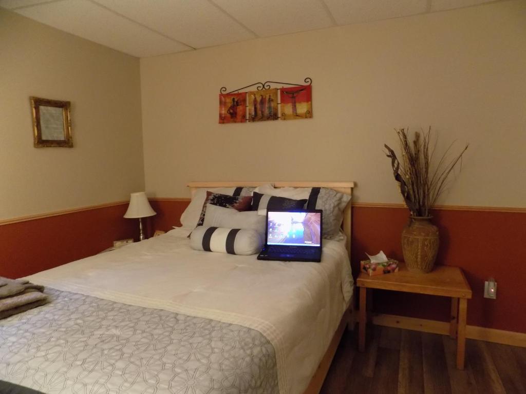 Una cama o camas en una habitación de Gîte Esprit Follet