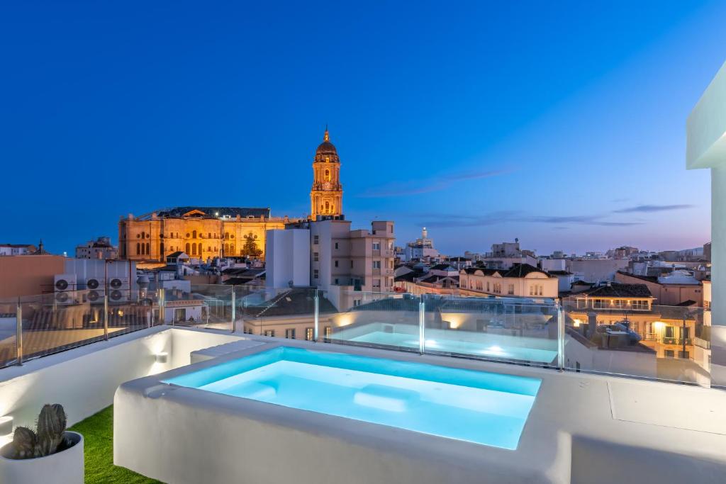 a swimming pool on the roof of a building at Ático 360º con Piscina in Málaga