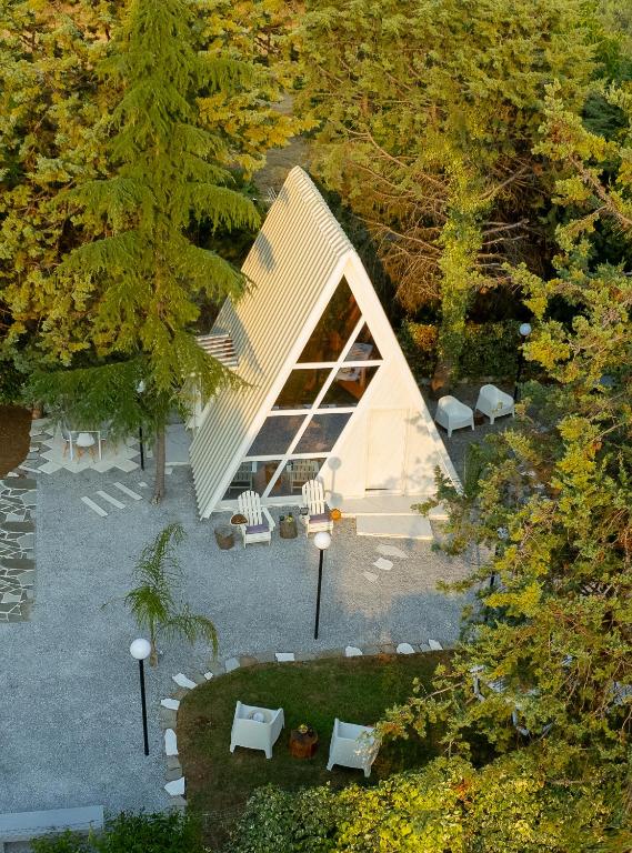 an overhead view of a house in a forest at White DIAMOND in Chalkidiki in Vergia