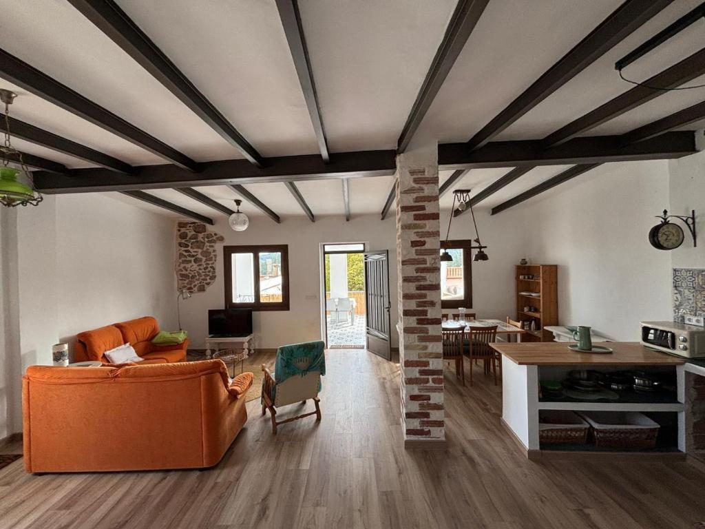 a living room with a couch and a table at Les Coves de Lluna in Vall de Uxó