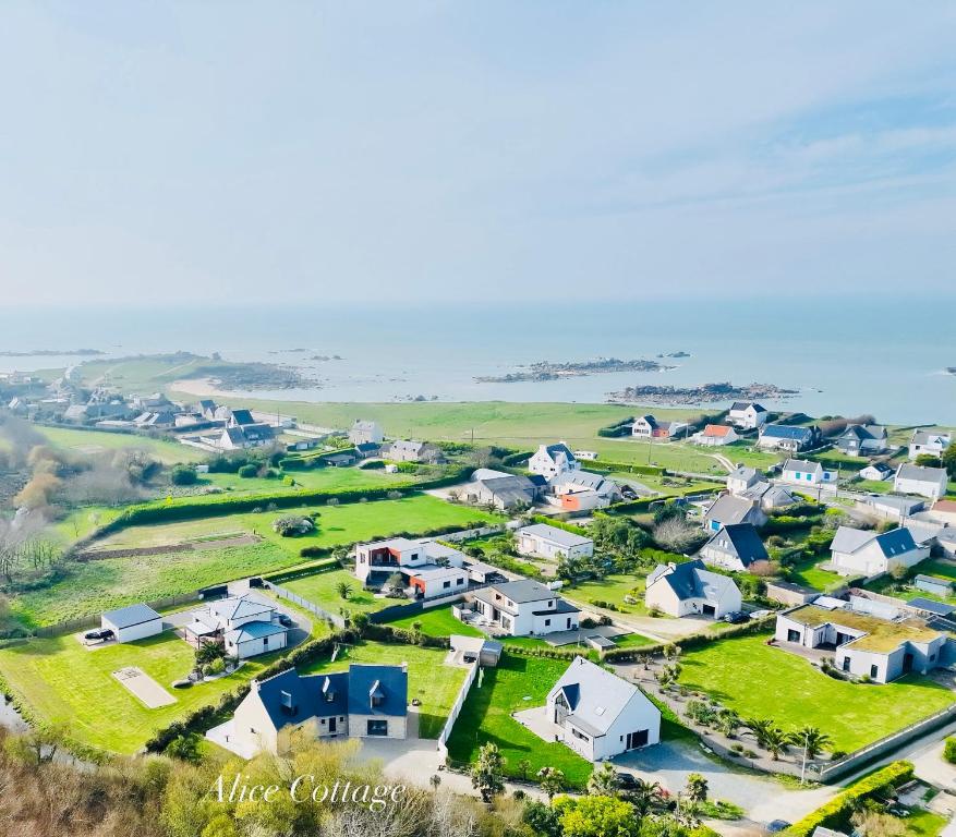 an aerial view of a small village next to the ocean at Alice Cottage in Cléder