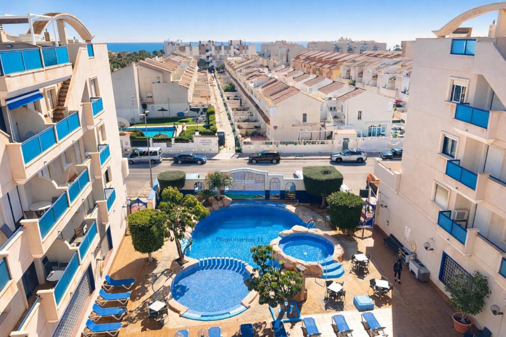 an aerial view of a resort with a swimming pool at Panoramic Sea View Cabo Roig in Orihuela Costa