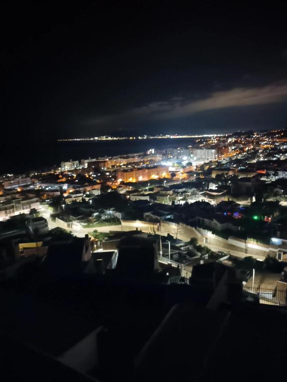 a view of a city at night at Apartamento Bahía Sol in Rincón de la Victoria