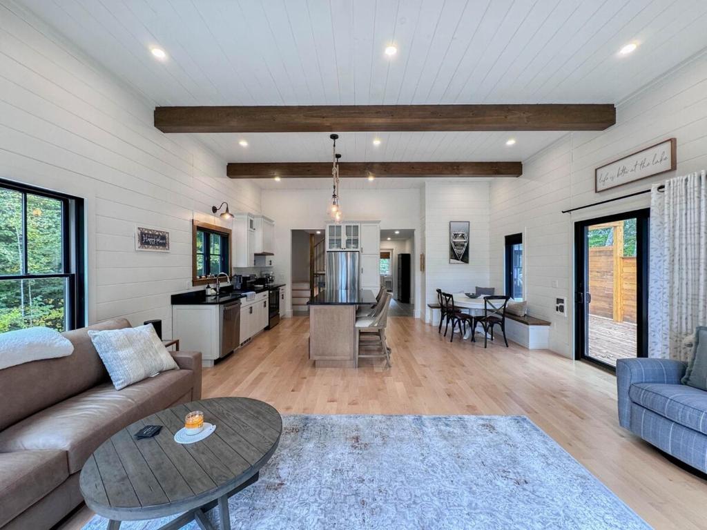 a living room with a couch and a table at Long Lake-Lake Front - in Bridgton
