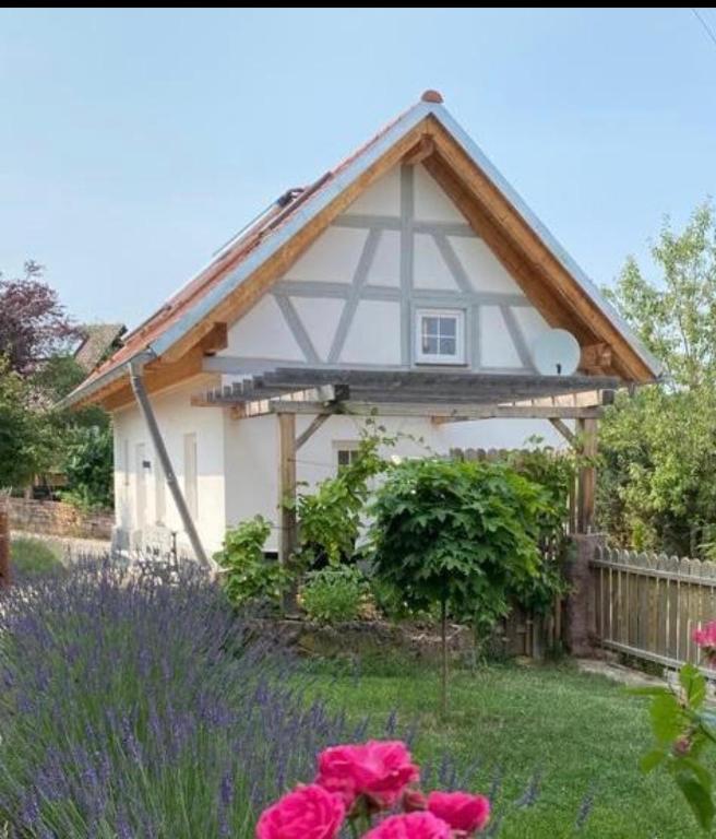 a small white house with a pitched roof at TinyLoft in Bad Teinach-Zavelstein