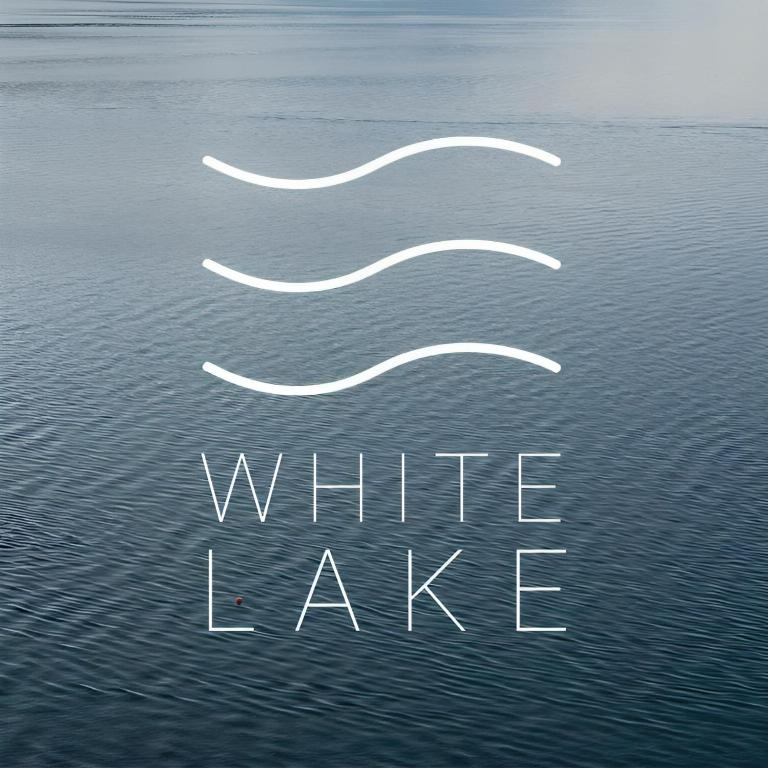 a white wake in the water with the words white lake at Villa White Lake - Ohrid Center Lakeside Accommodation in Ohrid