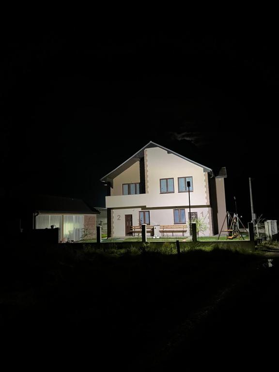 a large white house at night at Household Grbovic in Bijelo Polje