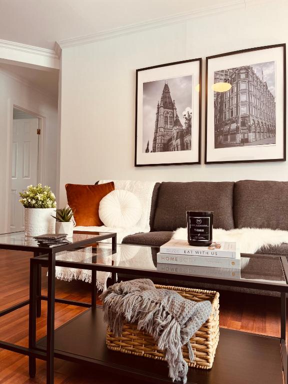 a living room with a couch and a table at Laurier Suites in Gatineau