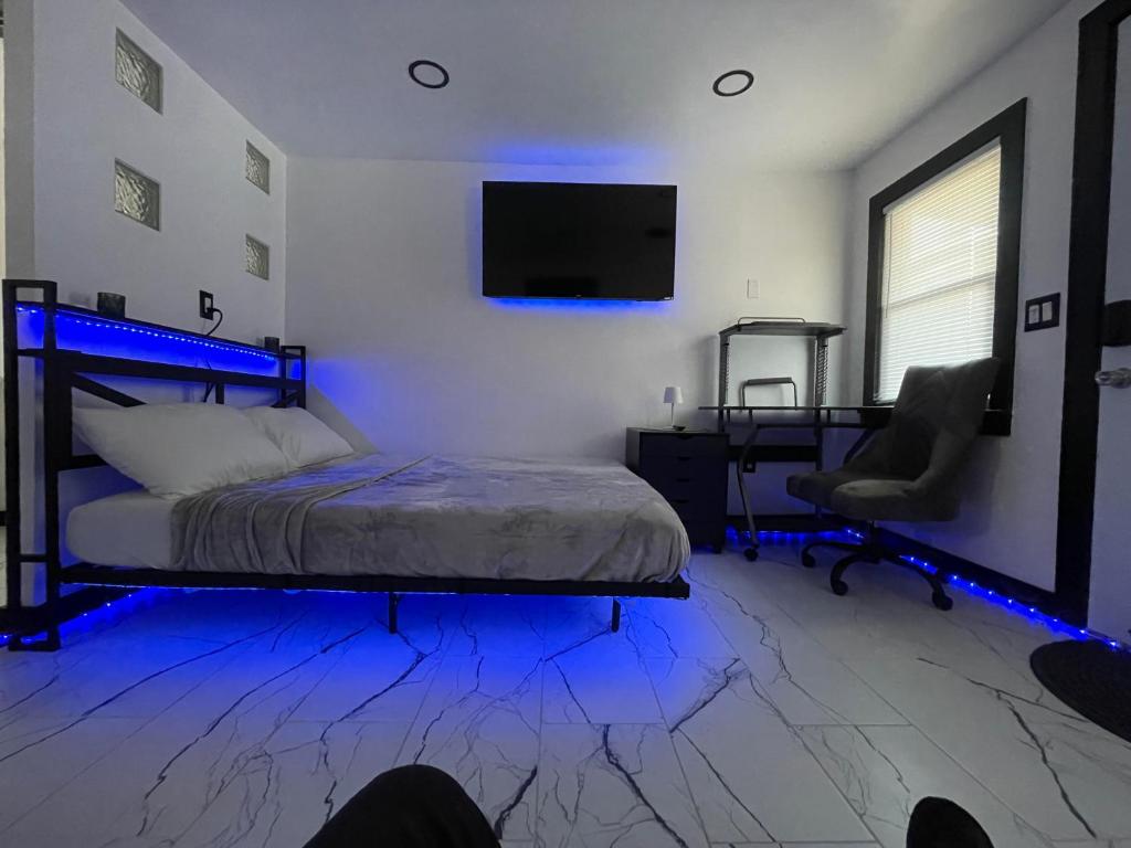 a bedroom with a bed and a desk and a chair at Tree Star Motel in Monroeton