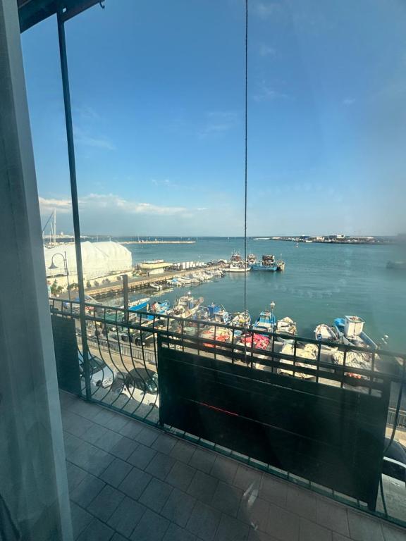 a view of a marina with boats in the water at Tower casa vacanze 2 in Anzio