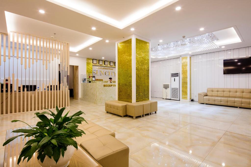 TV a/nebo společenská místnost v ubytování Sun City Hotel