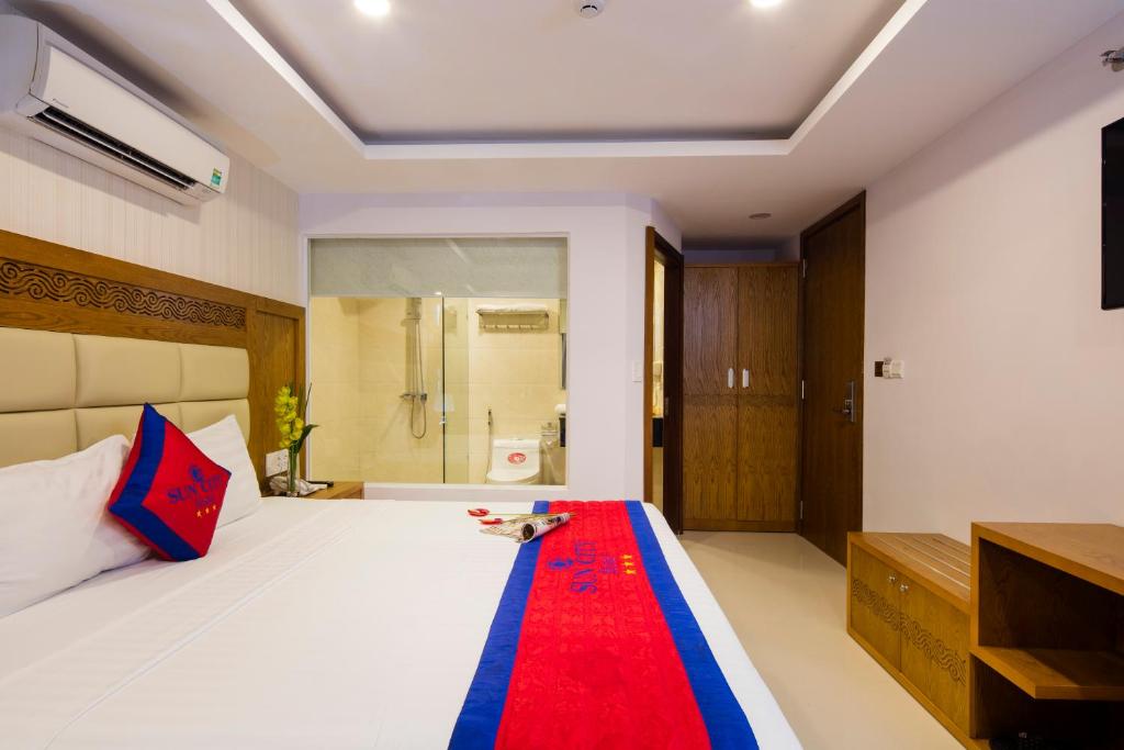 Postel nebo postele na pokoji v ubytování Sun City Hotel