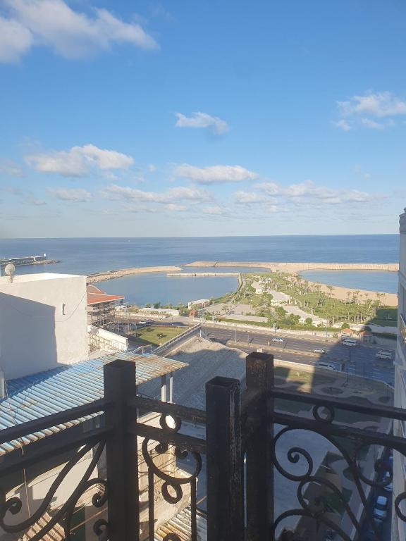 a view of the ocean from the balcony of a building at سي فيو سان ستفانو in Alexandria