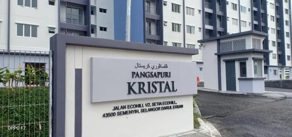 a sign in front of a building at D Kristal Apartment in Semenyih