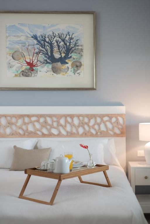 Postel nebo postele na pokoji v ubytování Hotel Casa Hemingway