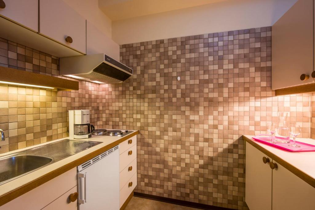 Kuchyň nebo kuchyňský kout v ubytování Aparthotel Andreas Hofer