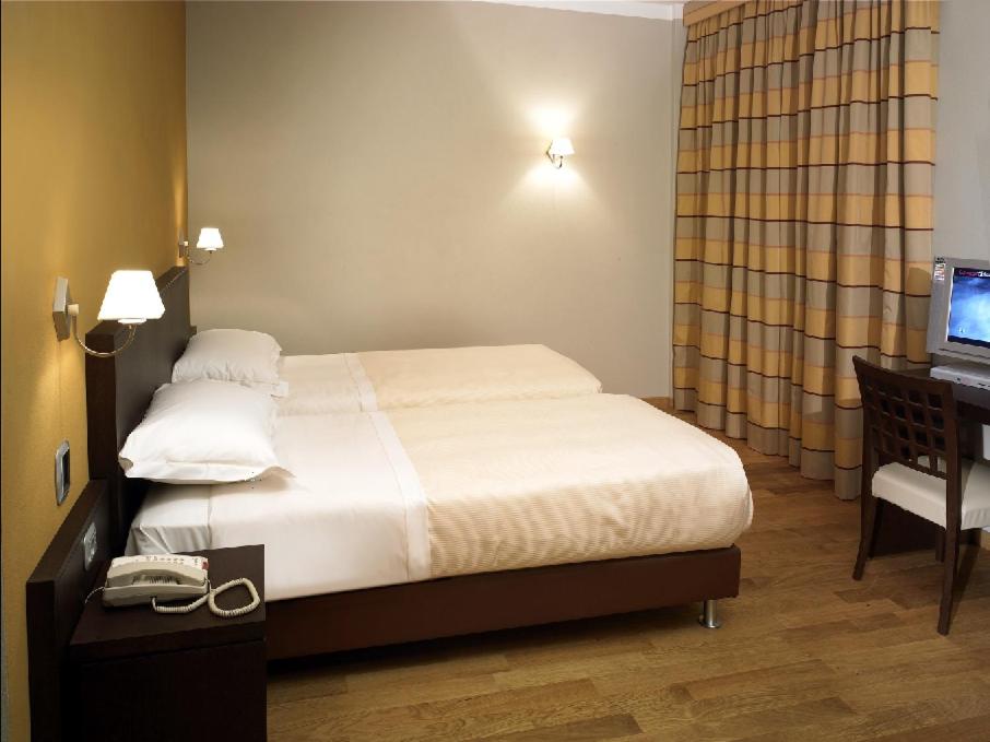 Postel nebo postele na pokoji v ubytování Hotel Dei Vicari