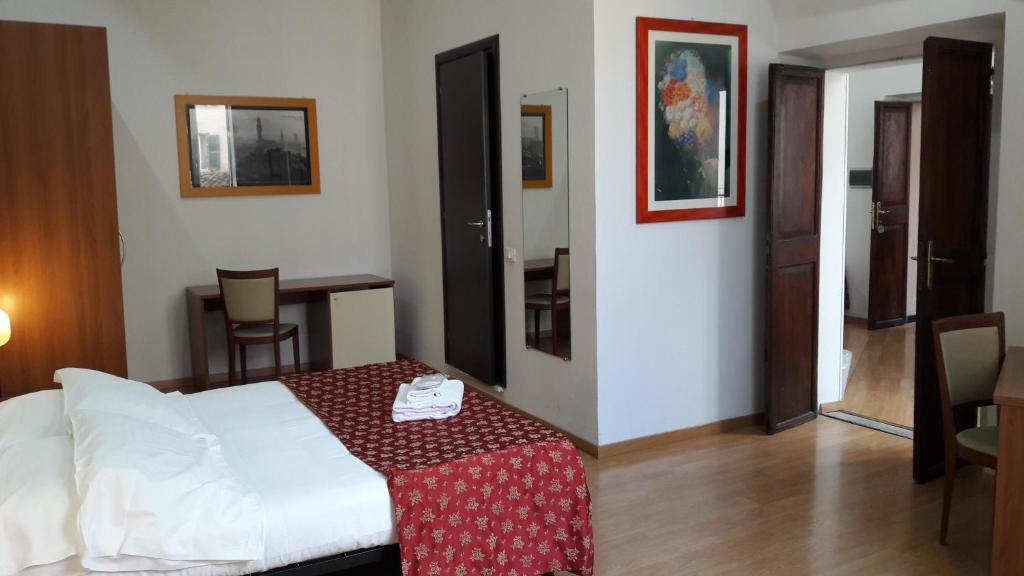 Postel nebo postele na pokoji v ubytování Hotel Mimosa Pantheon