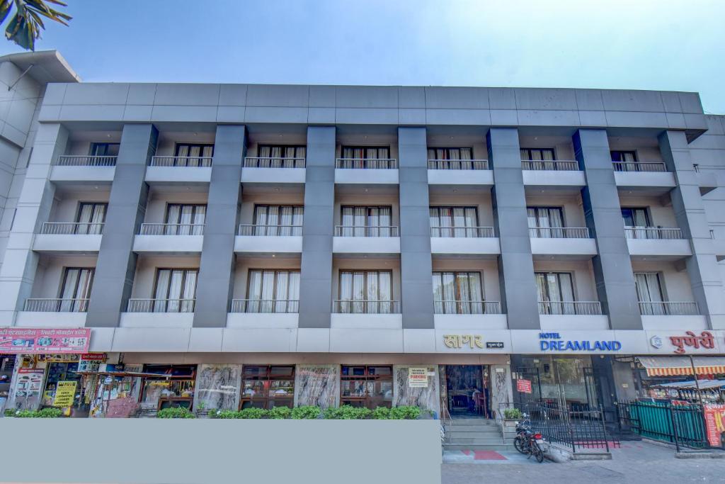 a large building with a lot of windows at Hotel Dreamland in Pune