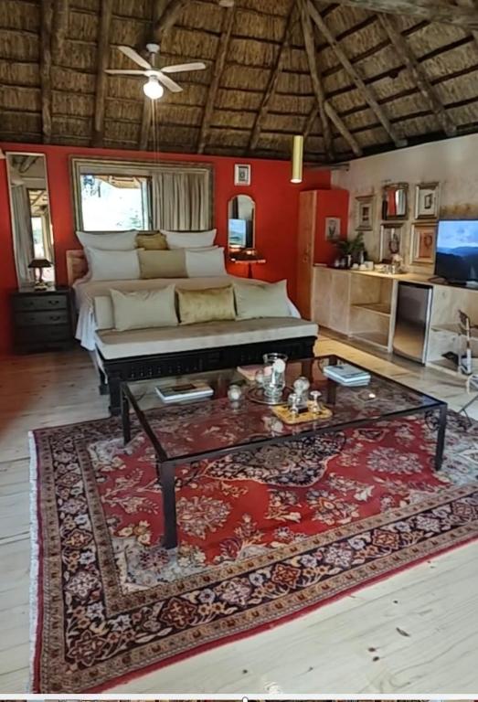 a living room with a couch and a coffee table at Lethabo Estate in Lanseria
